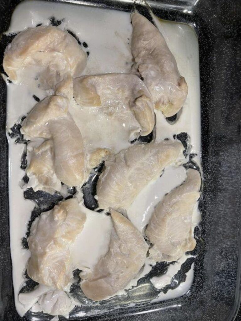 If you’ve ever cooked a chicken and noticed that it’s purging a white jelly-like substance, don’t worry! The gross goo may look unappetizing, but it’s actually a natural phenomenon caused by protein escaping the bird as it cooks. You pull your perfectly seasoned chicken breast out of the oven, and there it is – a strange, oozing white goo. You wanted a juicy, golden-brown masterpiece, but now your chicken looks like it’s melting. But don’t worry, this poultry predicament happens to chicken lovers everywhere, from casual home cooks to professional chefs, according to personal chef, Drew Curlett. “It might not be pretty, but it’s pretty normal to see white stuff come out of chicken, especially when baked or roasted,” the culinary instructor tells Reader’s Digest. What is the goop?