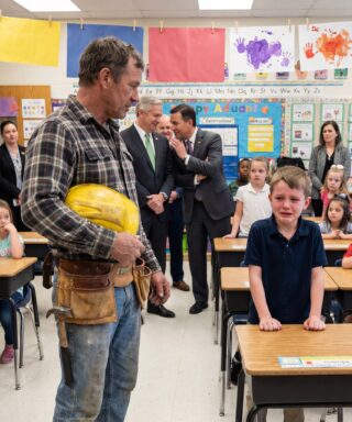 My old, grease-stained toolbelt made me the joke of Career Day — but one boy’s trembling confession turned the laughter into heavy silence.