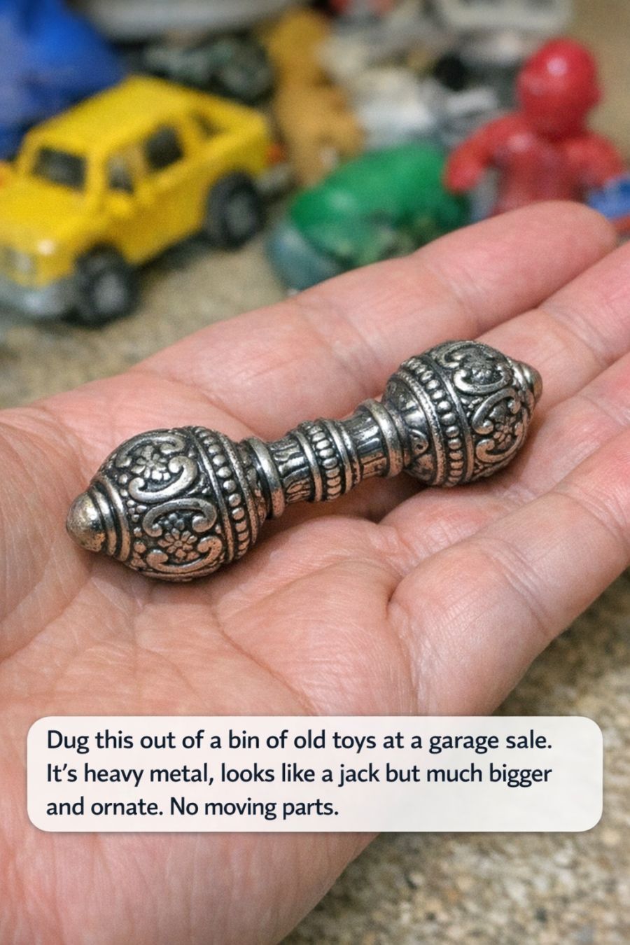 Dug this out of a bin of old toys at a garage sale. It’s heavy metal, looks like a jack but much bigger and ornate. No moving parts.