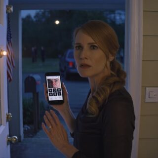 At 1 a.m., my neighbor whispered, “Don’t open the door”—then my security app flashed no connection, the porch light refused to turn on, and five minutes of knuckles on my Pine Street door made my whole house shake in a quiet American neighborhood, until the silence hit and I leaned into the peephole to see who was smiling on the other side. My phone was still buzzing in my hand when Mrs. Miller’s voice broke through, sharp with panic.